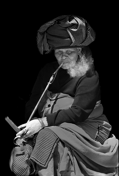 Woman smoking long pipe